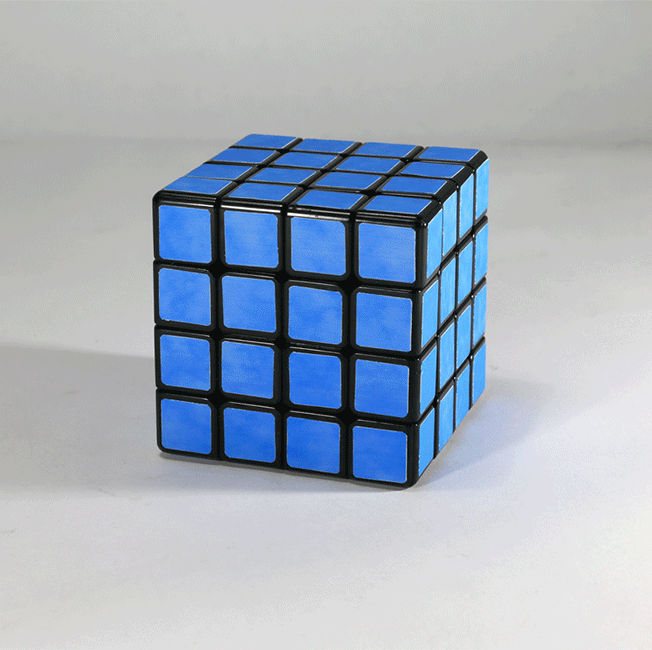 An animation of a blue Rubik's cube. The small cubes are collaged with small cut outs from an image of a blue sky. The cloud appears to be moving accross the Rubik's cube.