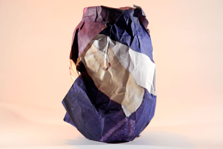 Vase made of paper and hands printed onto the paper